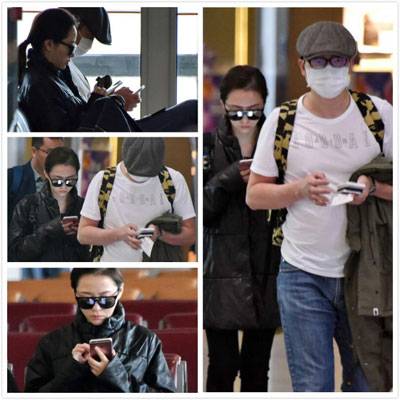 張靚穎馮軻現(xiàn)身機(jī)場 一路玩手機(jī)變無交流